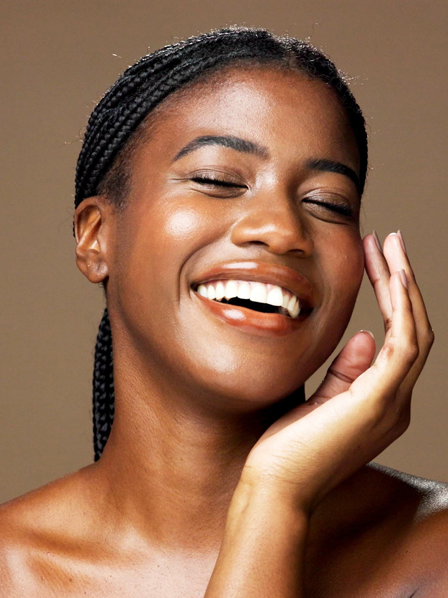 Mature woman smiling with her eyes closed