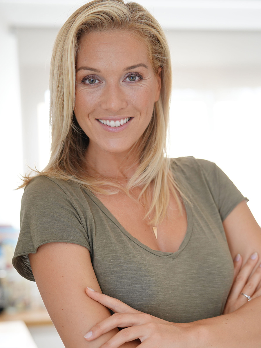 Woman in green shirt with blonde hair