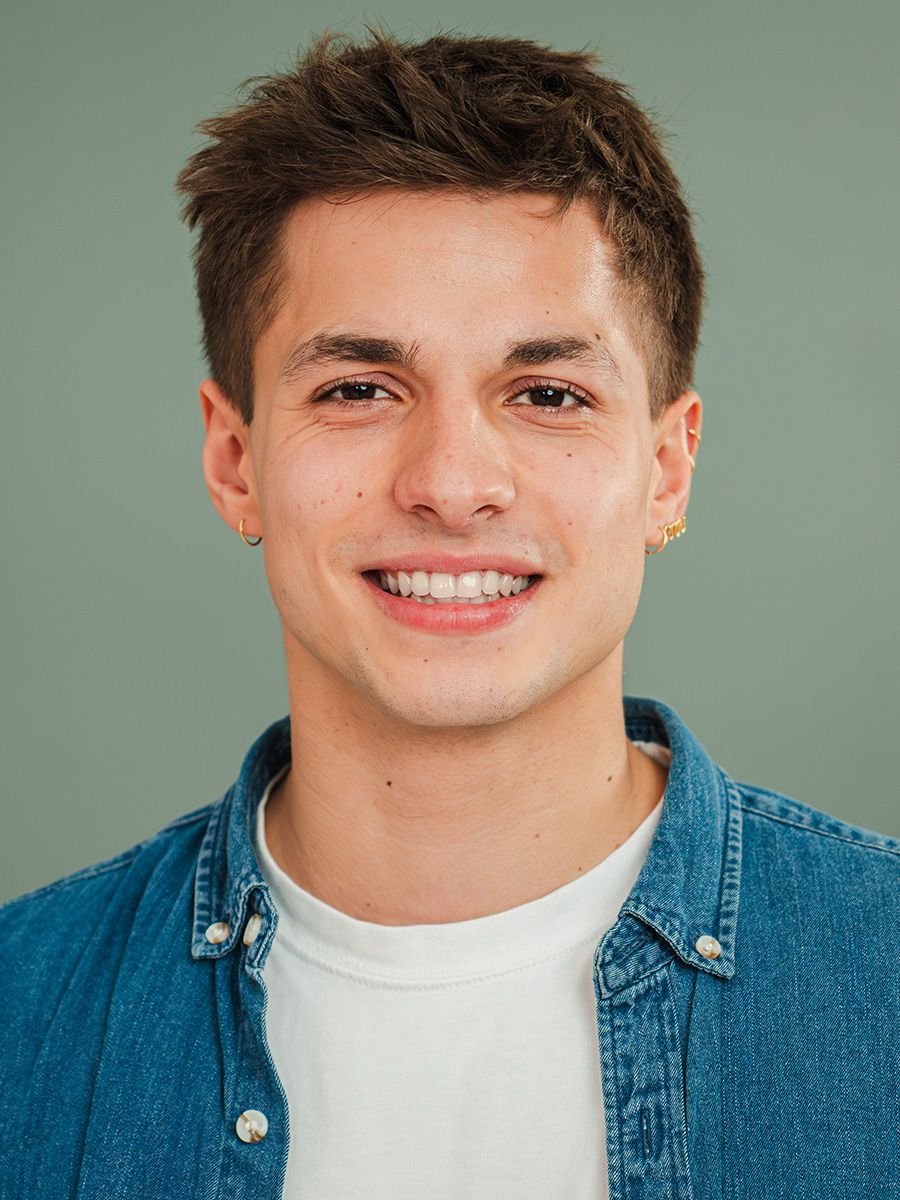 Portrait of a young man in a blue shirt