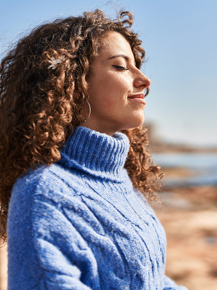 Woman in a blue turtle neck